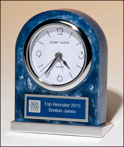 Airflyte Blue swirl Acrylic clock with polished silver aluminum base. Silver bezel, white dial, three-hand movement