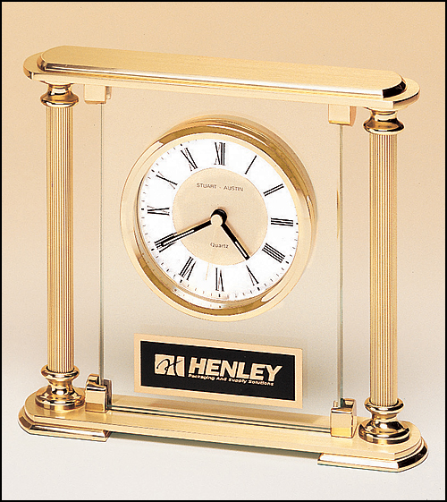 Airflyte Clock with glass upright, brass feet and top and metal goldtone columns