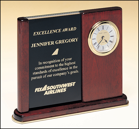 Airflyte Rosewood stained piano finish clock on a brass trimmed base