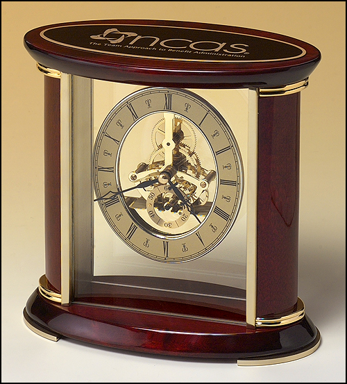 Airflyte Skeleton clock with sub-second dial, brass finished movement and rosewood piano finish accents