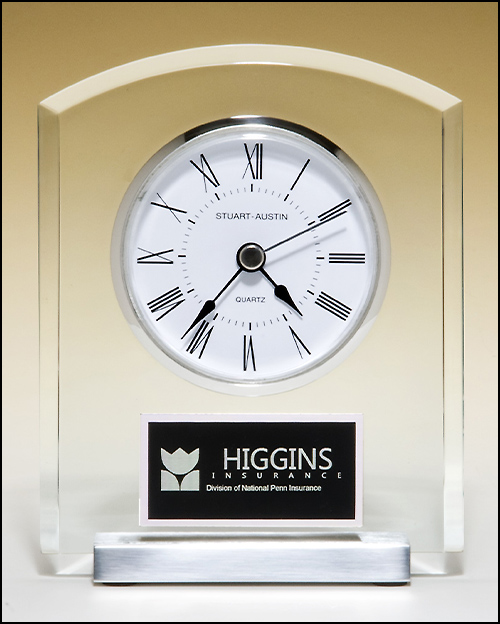 Airflyte Acrylic clock with polished silver aluminum base. Silver bezel, white dial, three-hand movement
