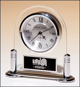 Airflyte Desk clock with beveled glass upright and silver metal base, three hand clock movement