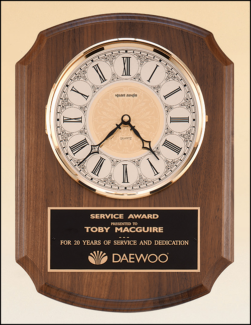 Airflyte American walnut vertical wall clock with Solid brass, diamond-spun bezel with glass lens, ivory dial and three hand movement