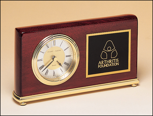 Airflyte Rosewood stained piano finish Airflyte clock on a brass base