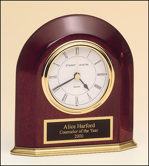 Airflyte Rosewood stained piano finish arched table clock with solid brass base and three hand movement