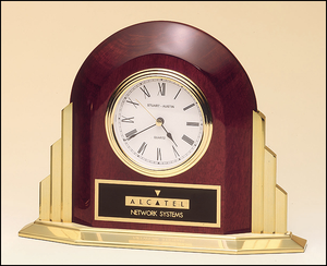 Airflyte Rosewood stained piano finish arched clock with solid brass base and sides with three hand movement