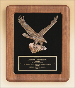 Airflyte American walnut frame with a sculptured relief Eagle casting on a black velour background